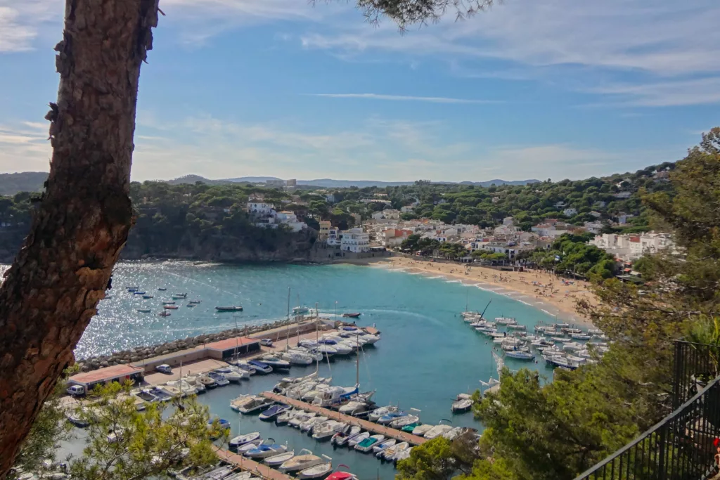 Llafranc, Spain in the Costa Brava is known for beautiful beaches and crystal-clear waters. A fantastic spot for summer in Europe.