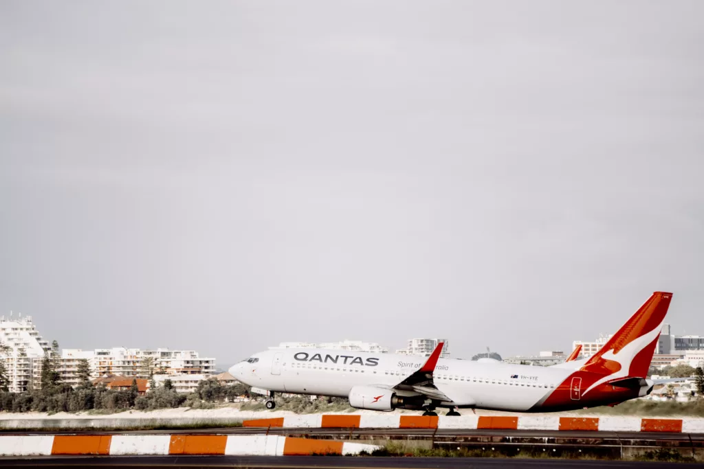 white and orange Qantas Boeing 737-838 airplane takes off - Qantas offers free in-flight Wi-Fi on domestic flights